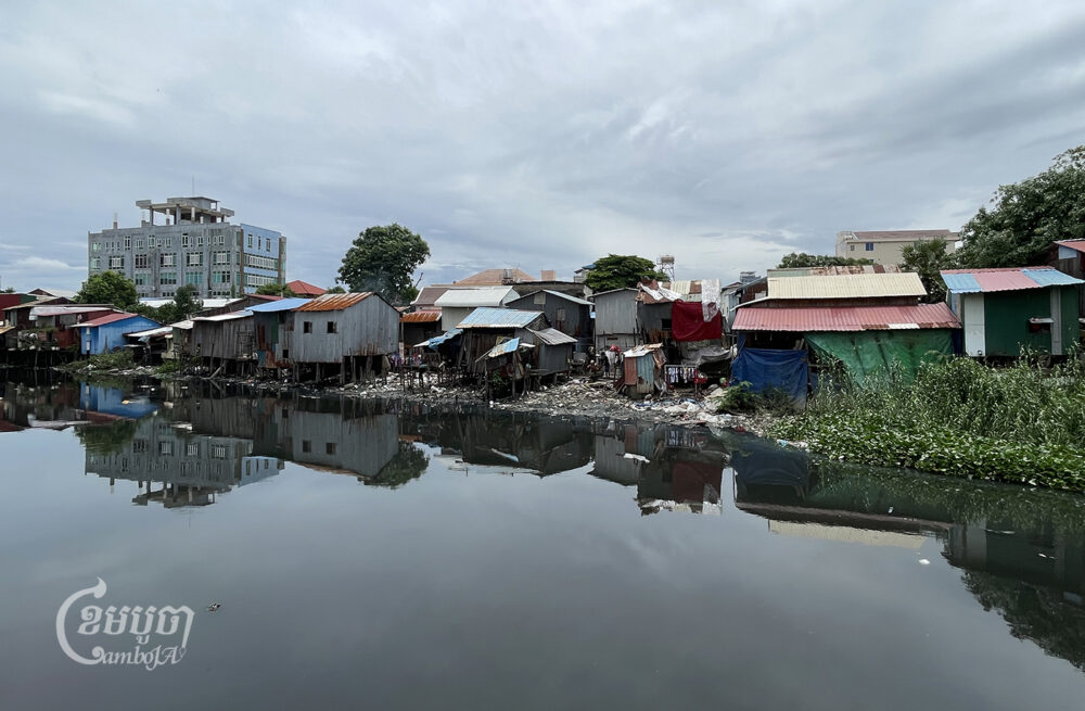 Stilt houses along a canal in an urban community